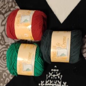 Three peaches and cream new with tags yarn balls